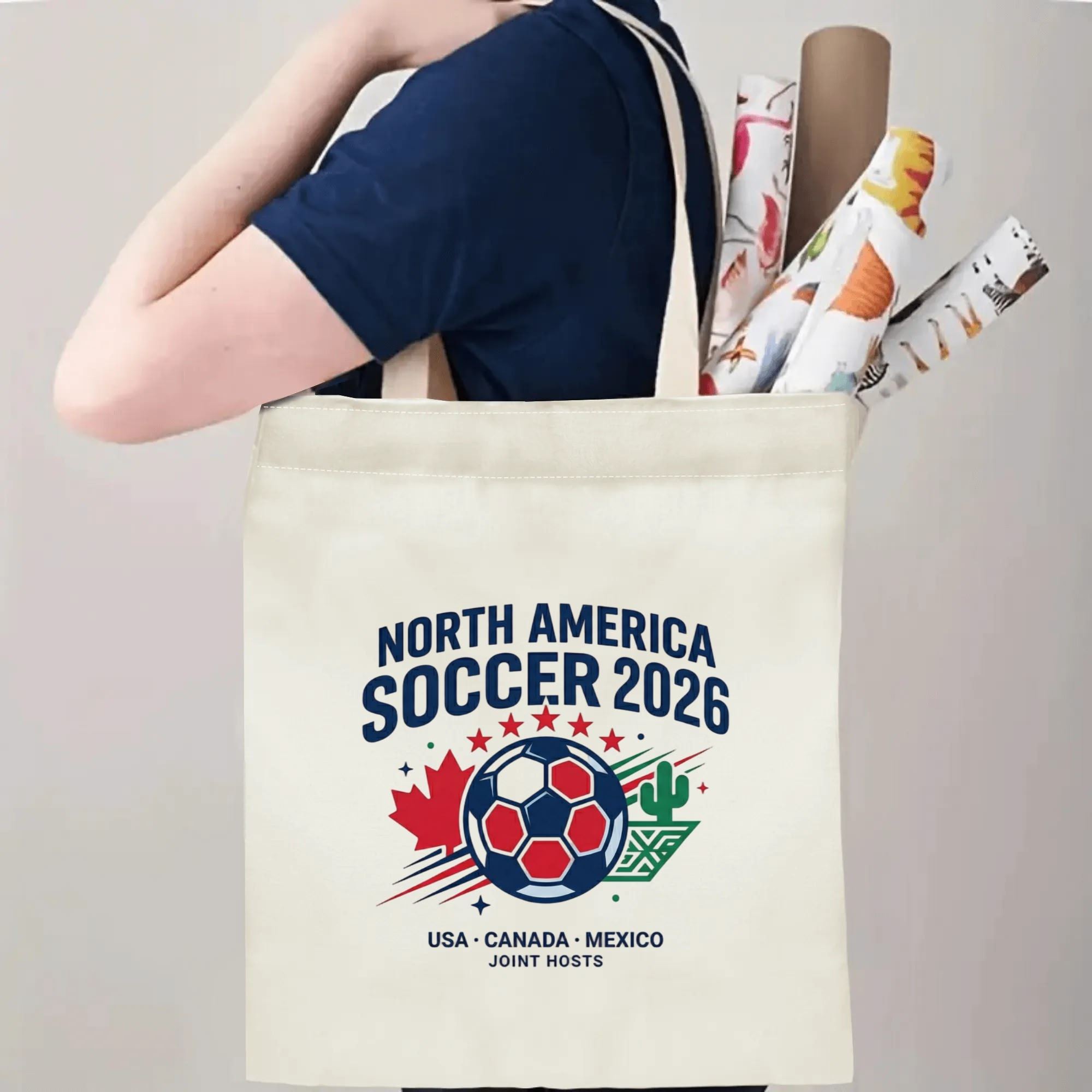Person slinging 2026 USA Canada Mexico soccer logo tote bag over shoulder, large capacity retro football fan carry bag for stadium trips