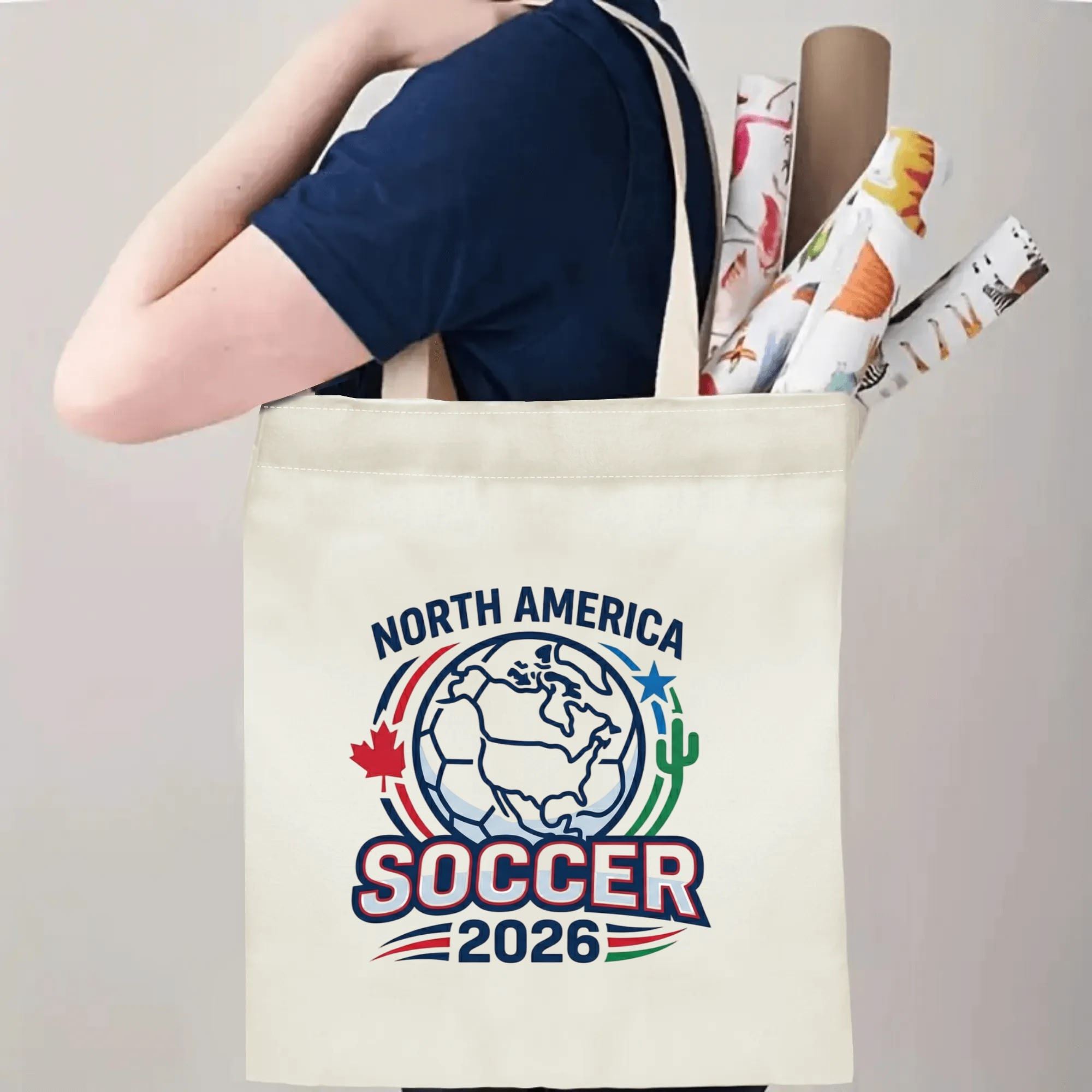 Person slinging clean North America Soccer 2026 canvas tote bag over shoulder, large capacity quiet patriotic football fan carry bag for stadium trips