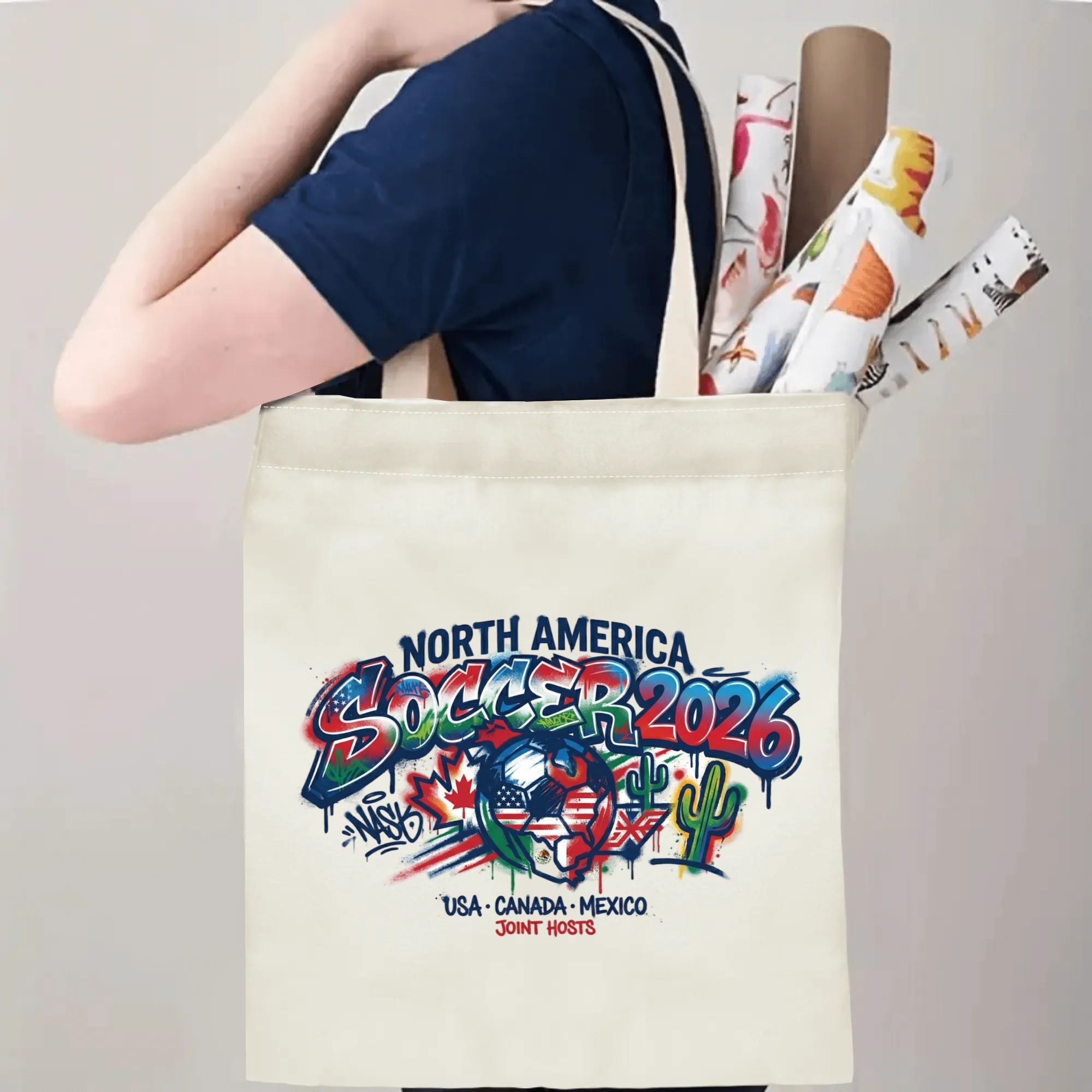Person slinging bold drip graffiti North America soccer tote bag over shoulder, large capacity standout football supporter carry bag for stadium trips