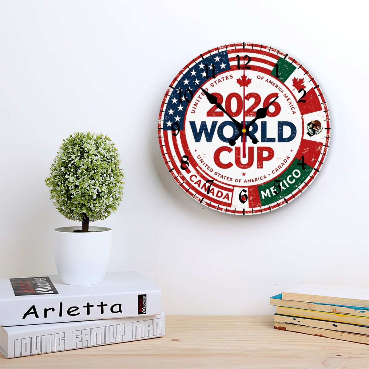 Lifestyle shot of the clock hanging in a bright, minimalist living room.