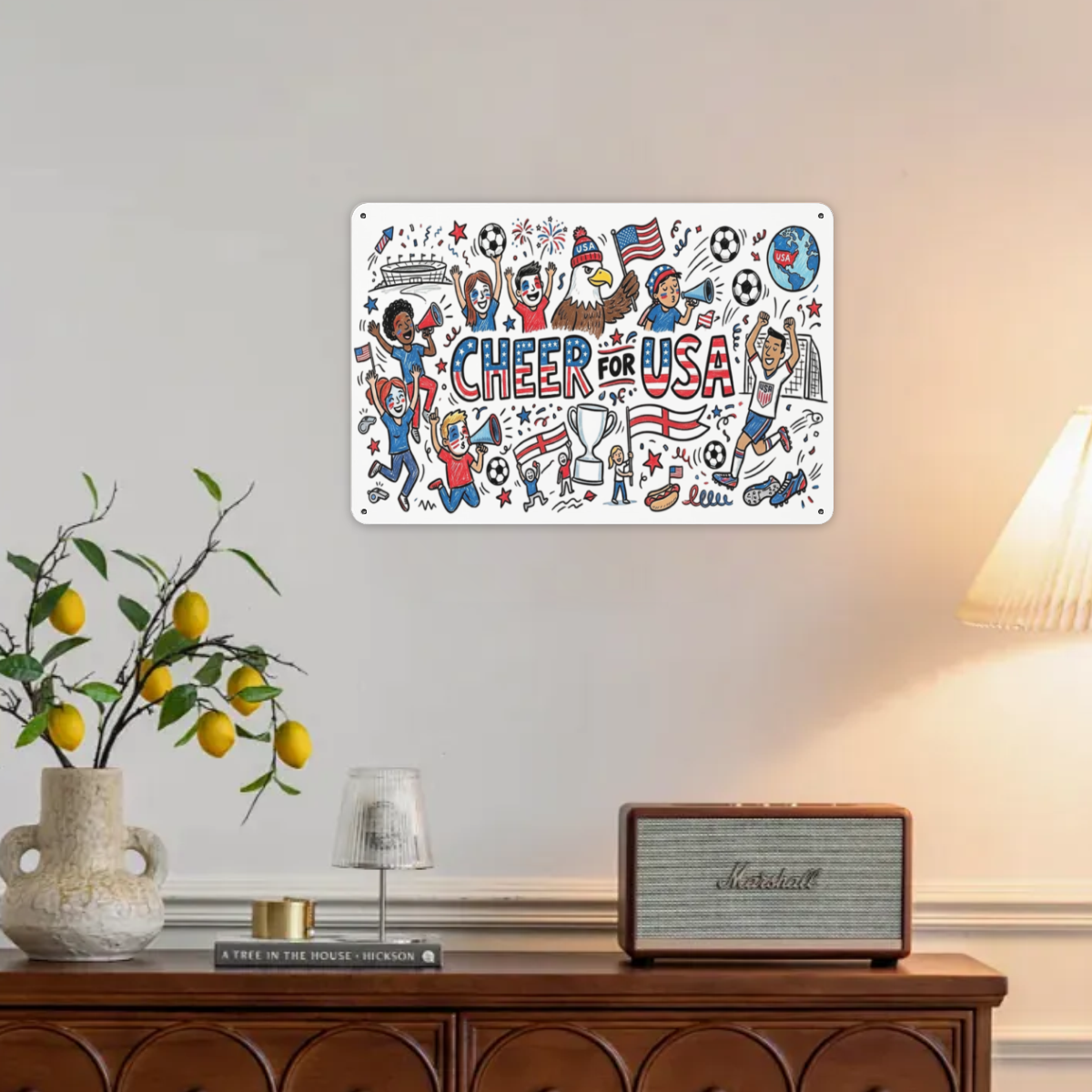 Lifestyle interior shot: Cheer For USA World Cup doodle tin sign hung on plain living room wall above wooden sideboard with home decor