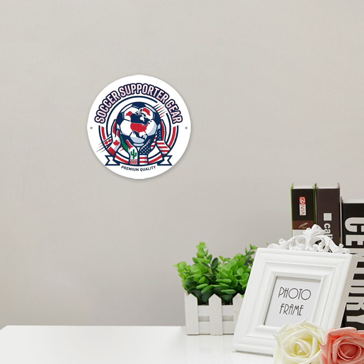 Round patriotic soccer metal sign mounted on interior living room wall beside table decor and photo frames