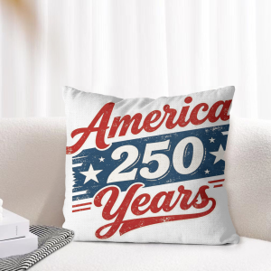 Patriotic vintage print pillow cover placed on indoor beige couch for home decor display