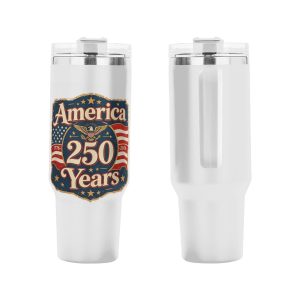 Patriotic tumbler placed in a car cup holder, showing the handle and straw in use