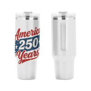 Patriotic tumbler placed in a car cup holder, showing the handle and straw in use