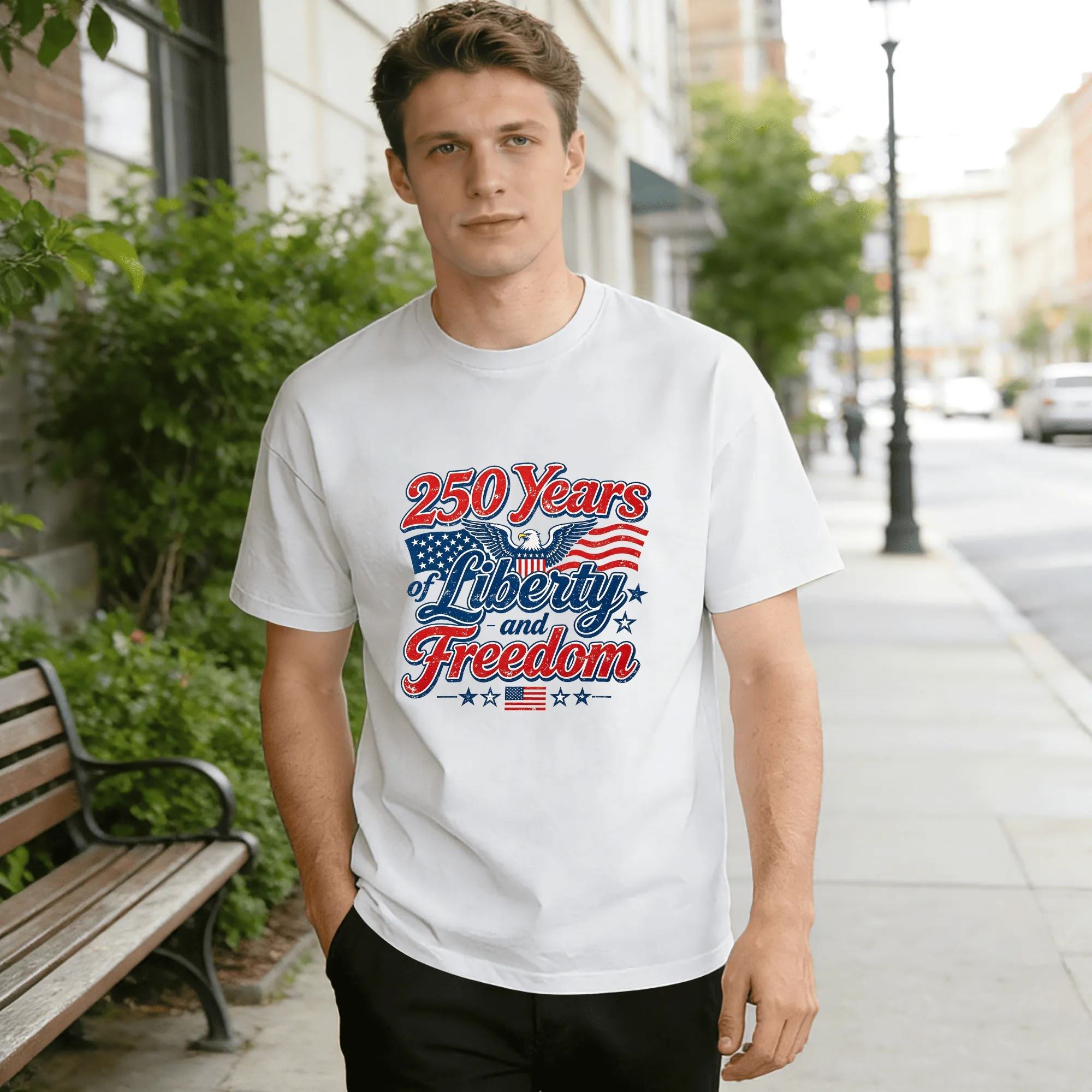 Man wearing white 250 Years of Liberty and Freedom print t-shirt in an urban street setting