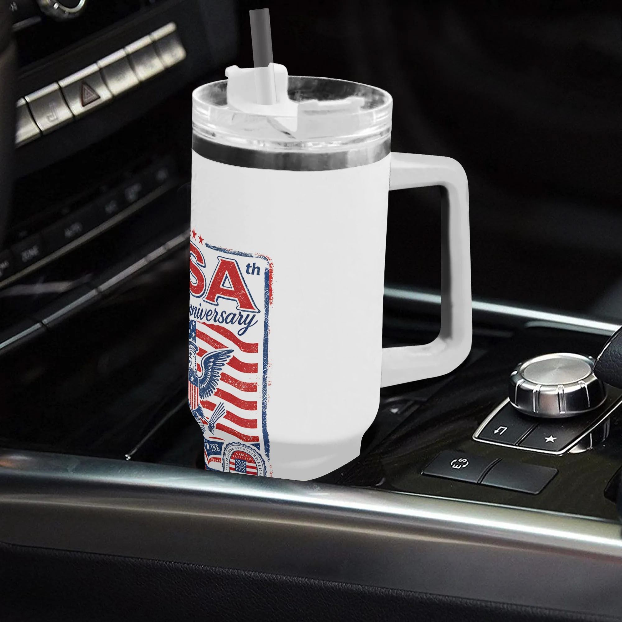 Lifestyle shot of the tumbler in a car cup holder, showing the patriotic print in use