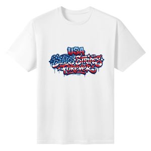 Flat lay of the white T-shirt featuring a vibrant graffiti print with "USA Stars & Stripes Forever" in flag-themed colors and spray-paint drips.