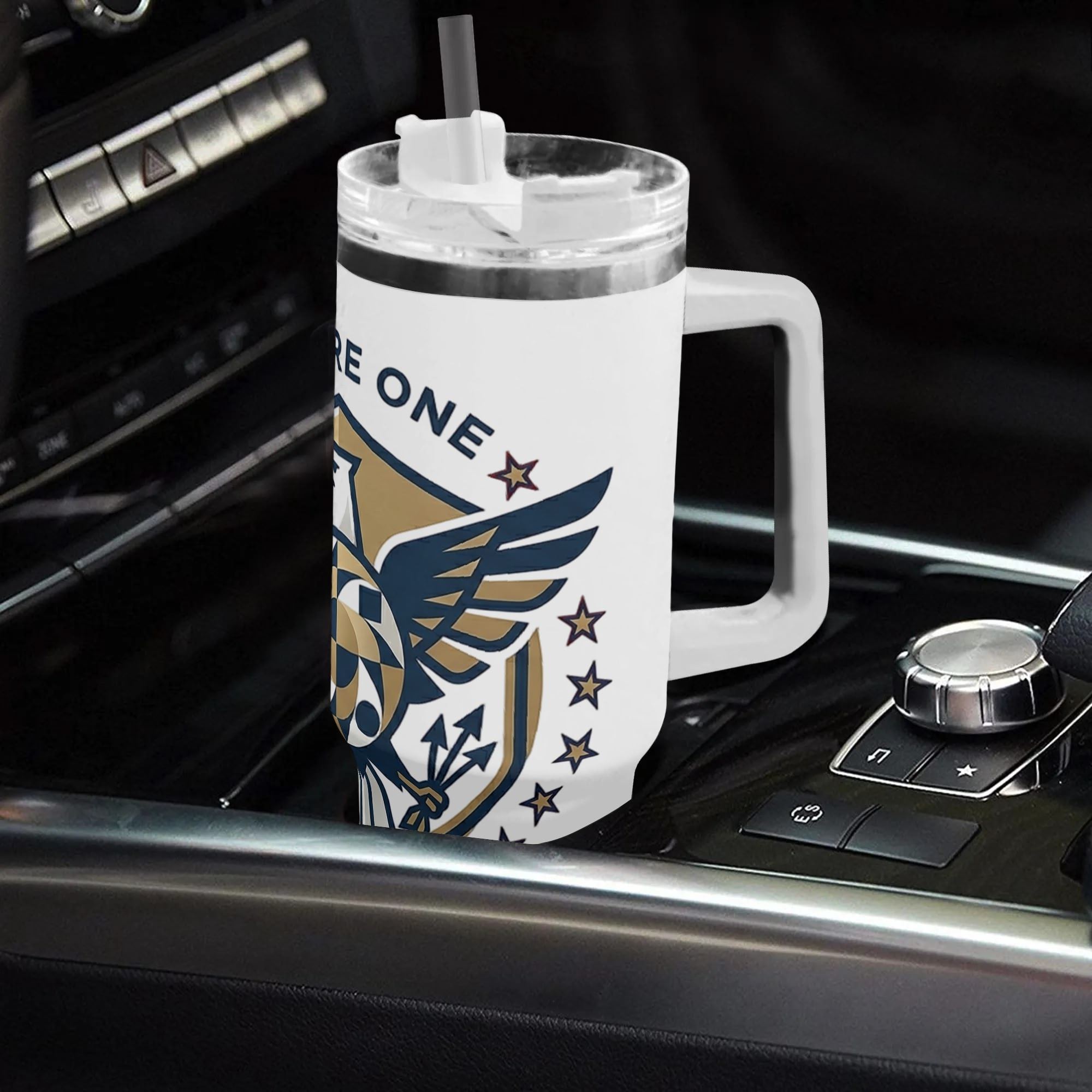 40oz USA 250th anniversary patriotic tumbler with handle placed in car center console, navy gold bald eagle shield "We Are One Forever America" print insulated stainless steel travel mug