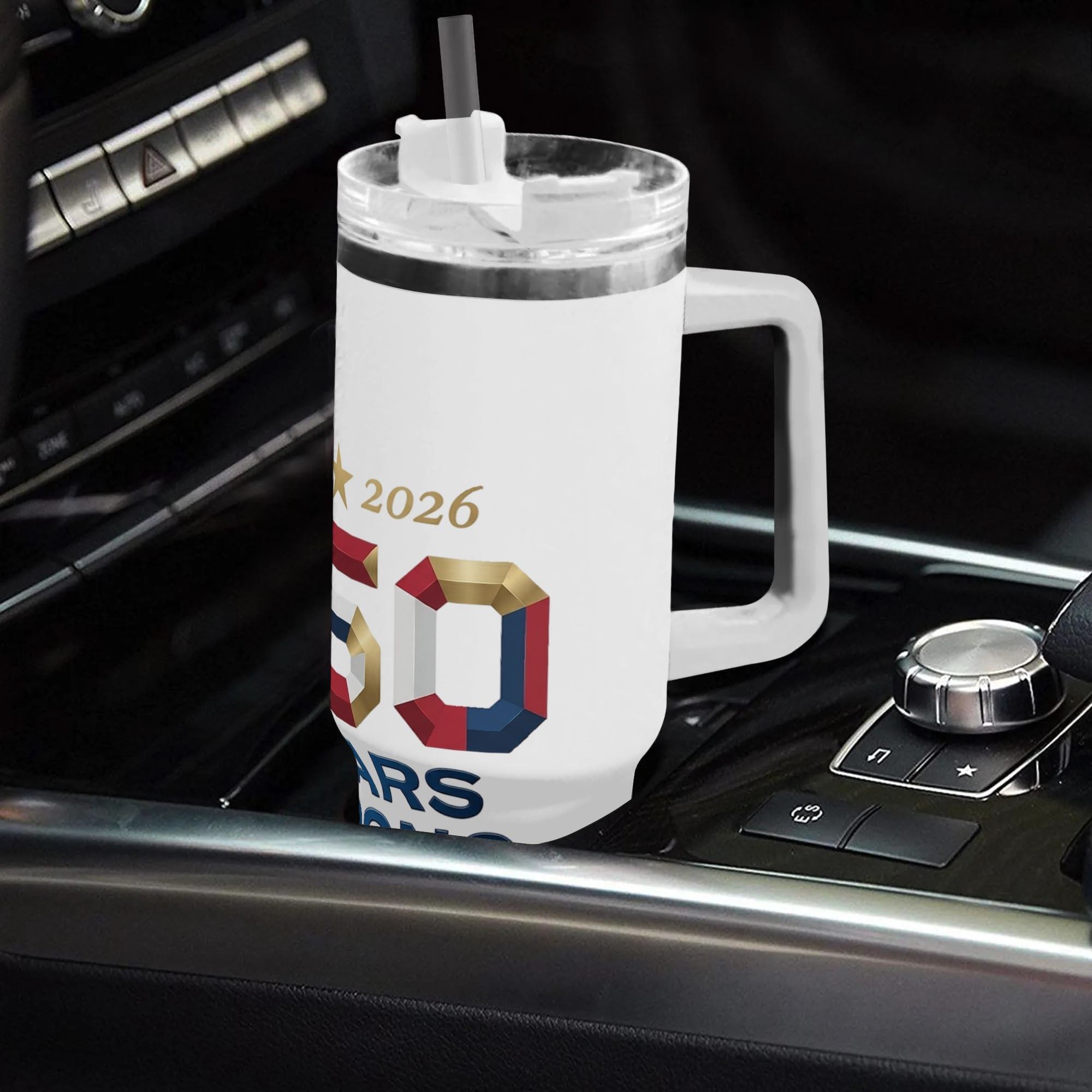 Car interior lifestyle photo: Matte white 40oz insulated tumbler with ergonomic handle placed on car gear shift console, 360 wrap 3D "250 Years Strong" patriotic print, commemorative USA 250 anniversary large capacity travel water cup