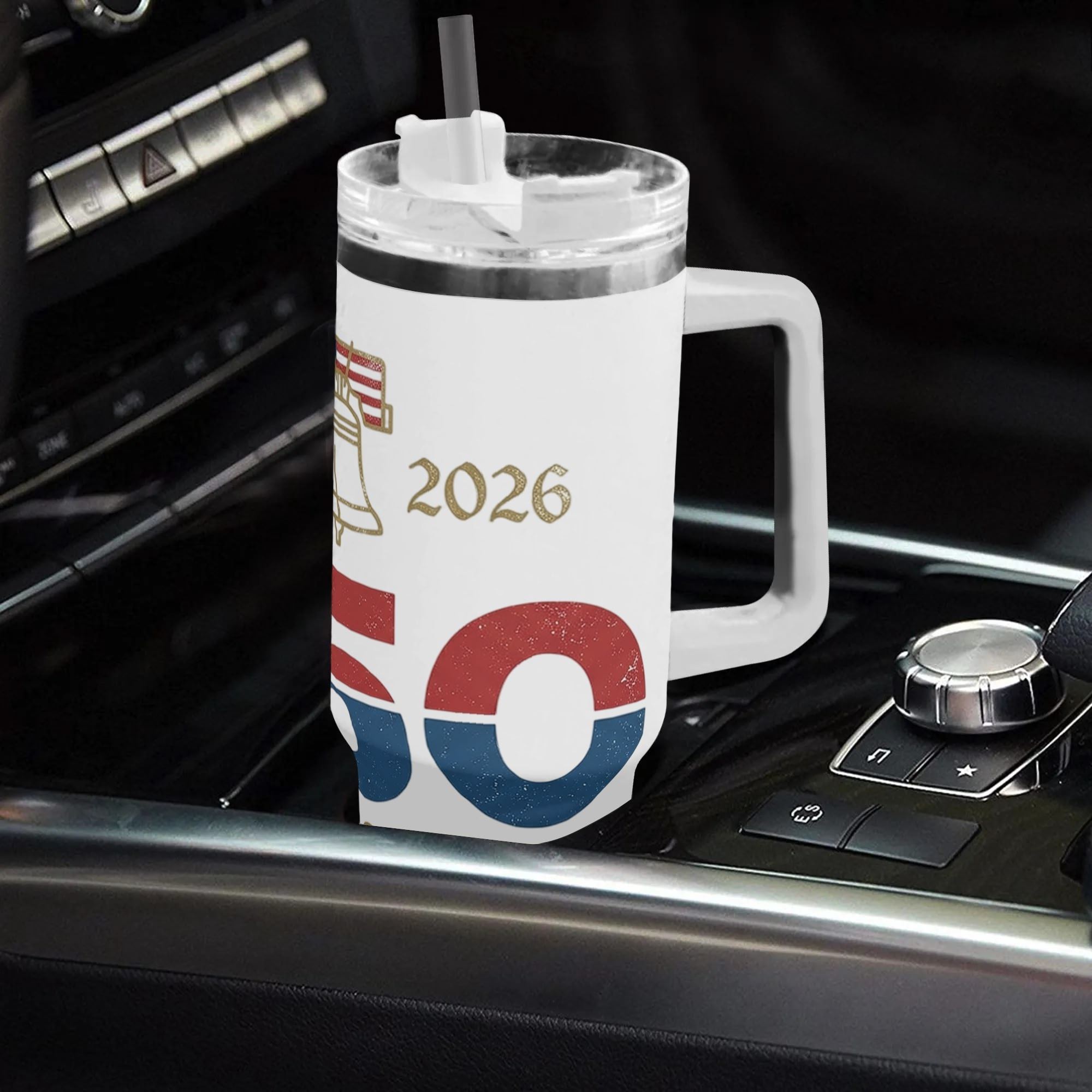 40oz USA 250th semiquincentennial patriotic tumbler with handle placed in car center console, vintage distressed Liberty Bell 1776-2026 "250 Years Strong" red blue gold print insulated stainless steel travel mug
