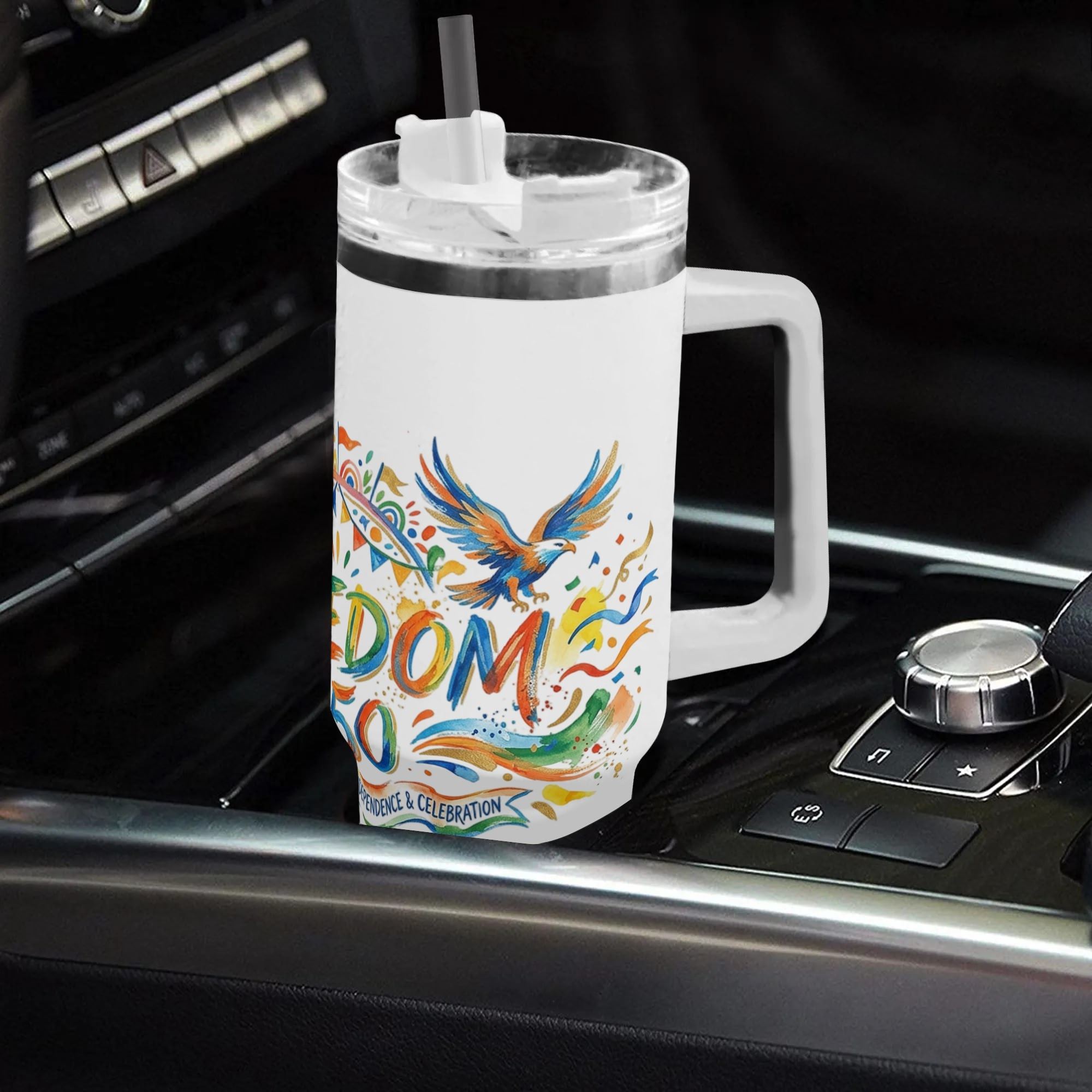 40oz USA 250th semiquincentennial tumbler with handle placed in car gear console, colorful watercolor bald eagle confetti "Freedom 250" patriotic full wrap insulated stainless steel travel mug