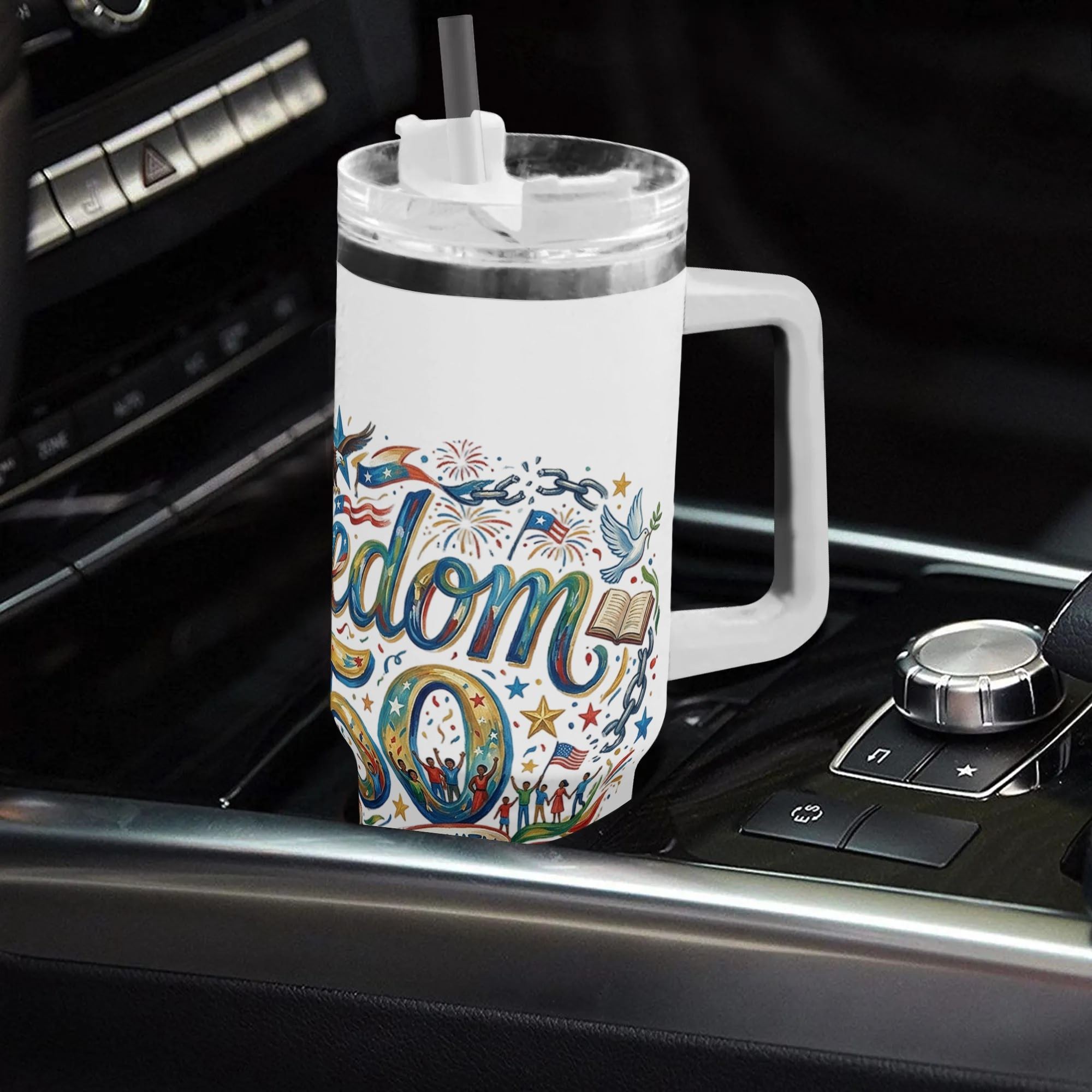 White 40oz handle tumbler with Freedom 250 patriotic print in car cup holder