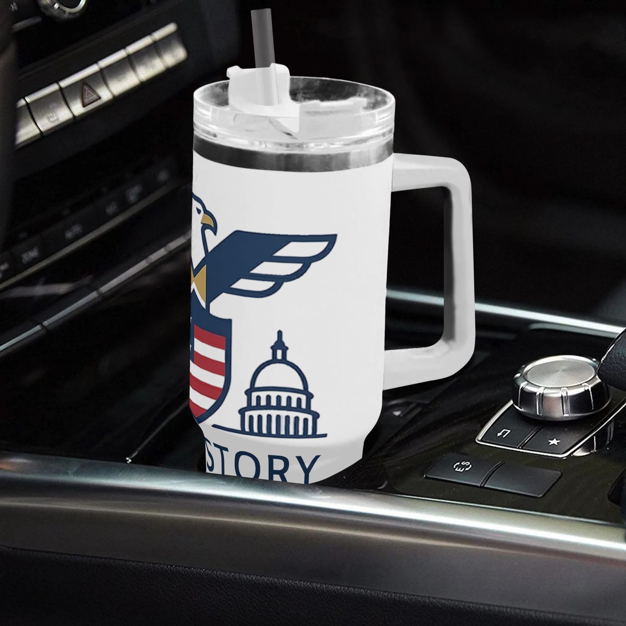 40oz USA 250th semiquincentennial tumbler with handle resting in car gear console, minimalist line art bald eagle US Capitol Statue of Liberty US History full wrap insulated stainless steel travel mug