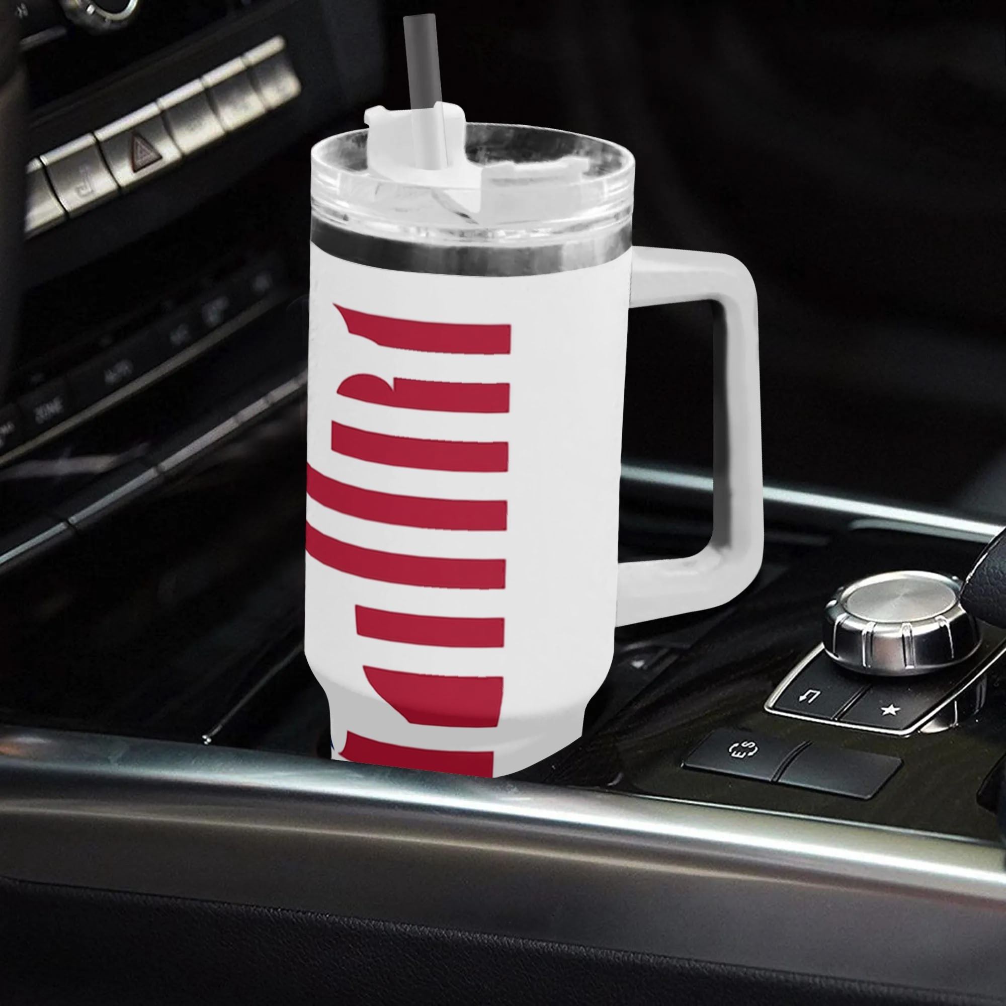 White 40oz handle insulated tumbler with Betsy Ross liberty bell US History 1776 print placed in car gear shift, USA 250th bicentennial travel mug