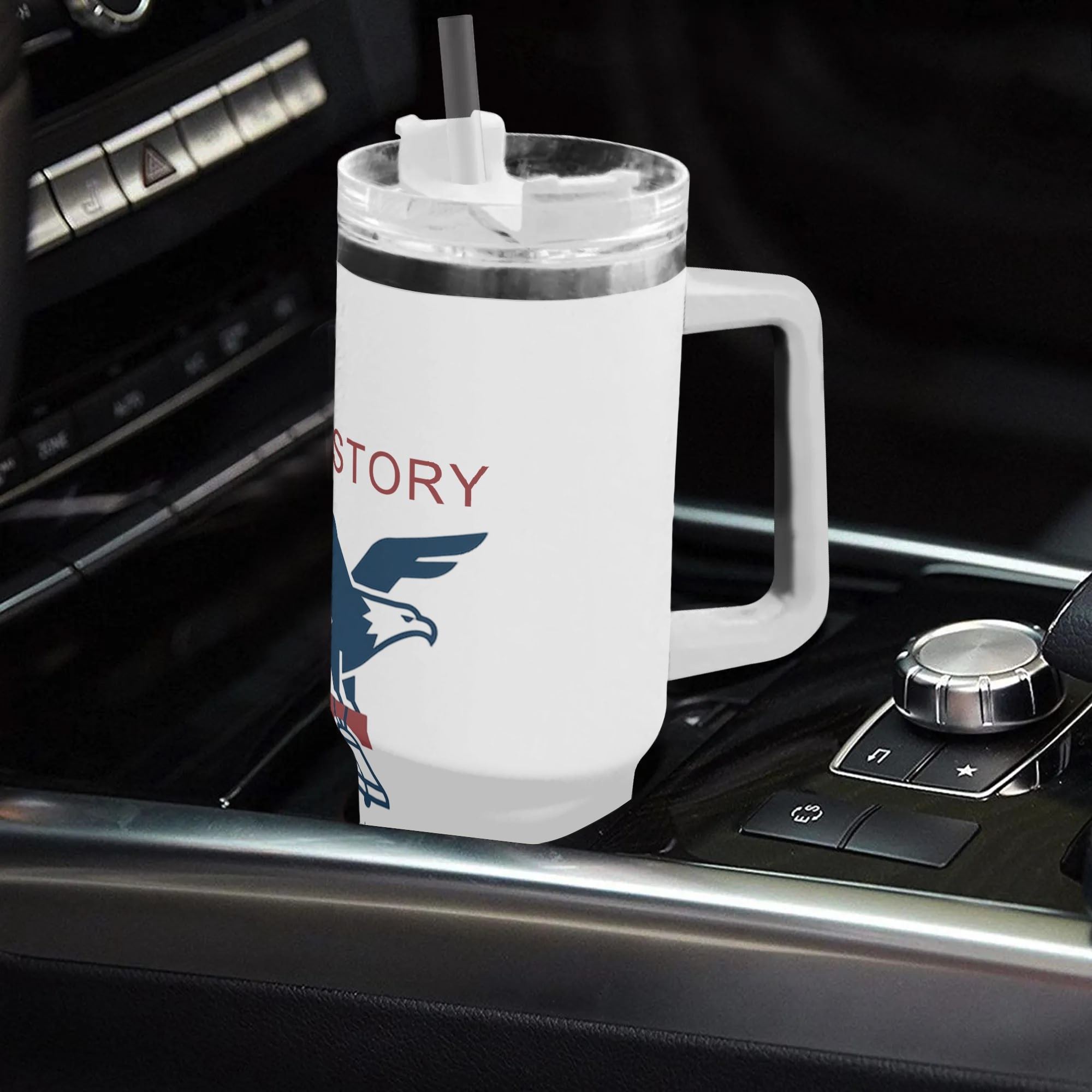 White 40oz handle tumbler with US History eagle 1776 print in car cup holder