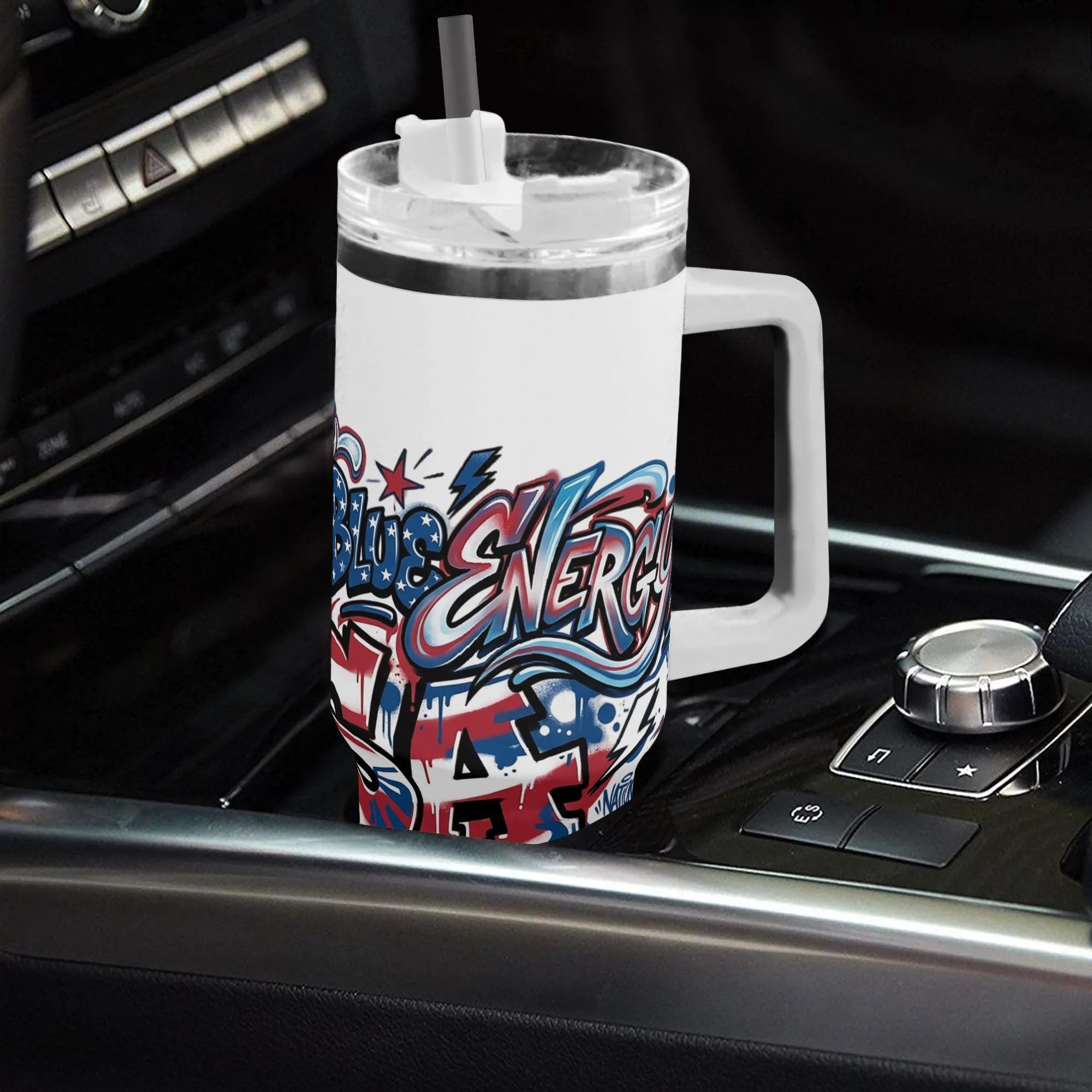 40oz USA 250th anniversary patriotic tumbler with handle placed in car center console, red white blue graffiti drip USA flag print insulated stainless steel travel mug