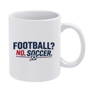 White ceramic mug printed with the playful phrase "FOOTBALL? NO, SOCCER." and a small soccer ball graphic with red-and-blue accent lines.