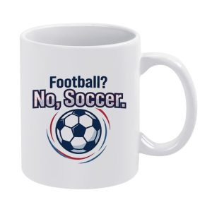 White 11oz ceramic mug featuring the playful slogan "Football? No, Soccer." with a classic soccer ball surrounded by red and blue swirling decorative lines.