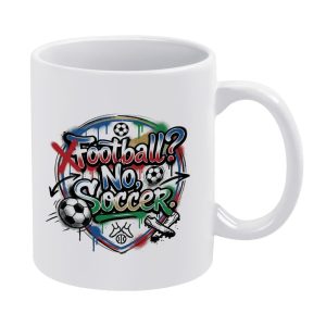 White 11oz ceramic mug with a vibrant graffiti-style print reading "Football? No, Soccer.", featuring dripping paint, soccer balls, cleats, and a crossed-out "Football" graphic.