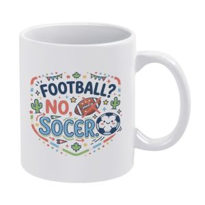 White 11oz ceramic mug featuring a colorful cartoon print: "FOOTBALL? NO, SOCCER" with a crossed-out American football, smiling soccer ball, cacti, maple leaves, and festive party bunting details.