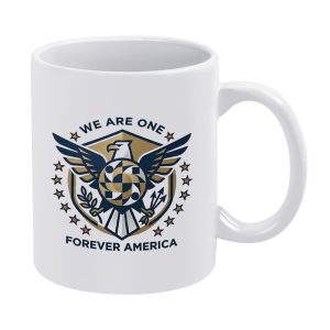 White 11oz ceramic mug with a premium "WE ARE ONE FOREVER AMERICA" print featuring a geometric American eagle emblem in navy and gold tones.