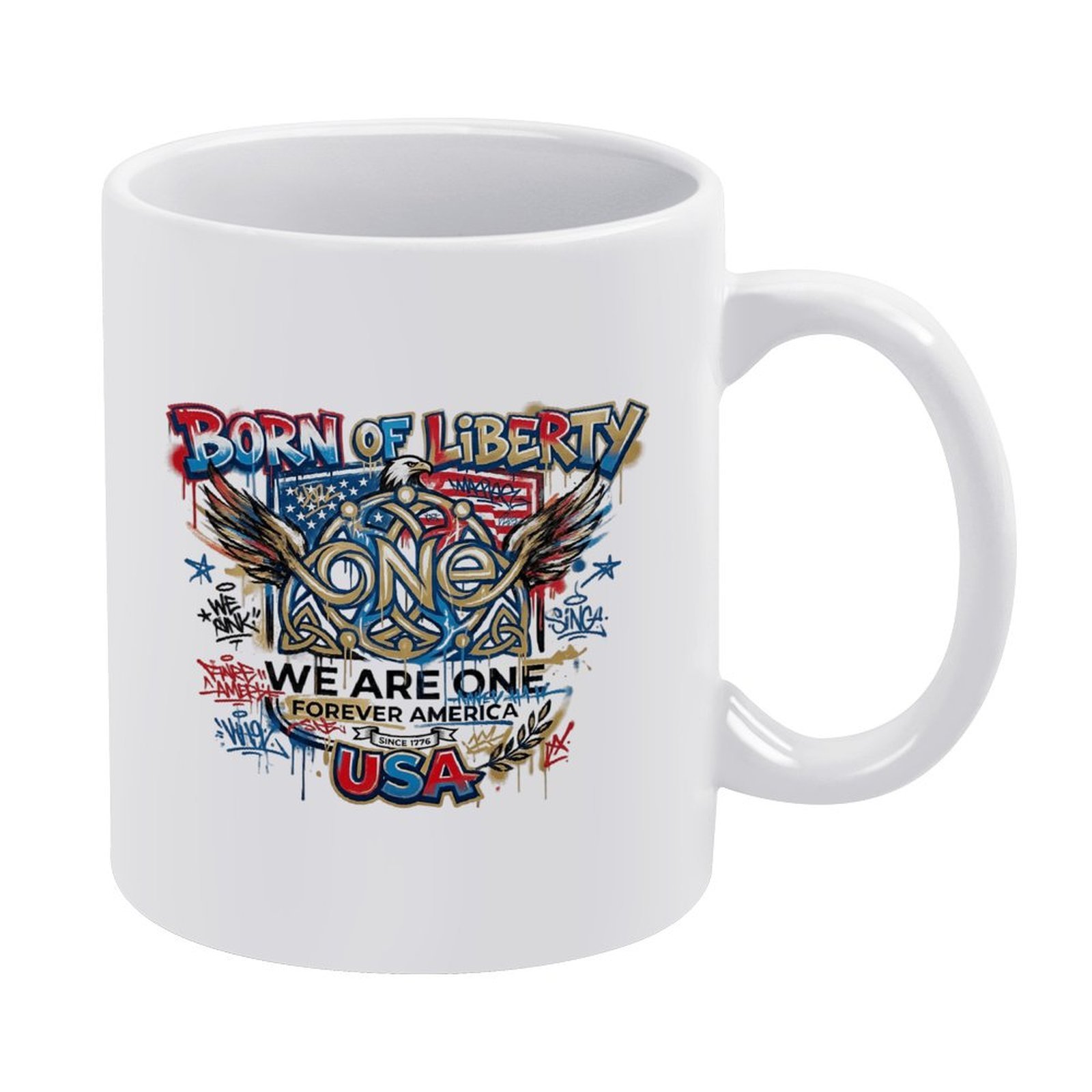White 11oz ceramic mug with vibrant graffiti-style patriotic print reading "BORN OF LIBERTY", "WE ARE ONE FOREVER AMERICA" and "USA", decorated with eagle wings, American flag details and street art splatters.