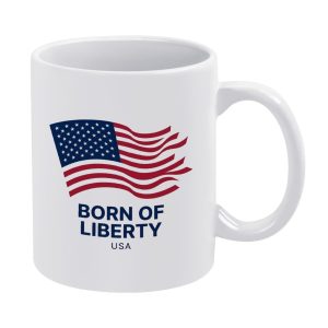 White 11oz ceramic mug with a classic wavy American flag print and bold text "BORN OF LIBERTY USA".