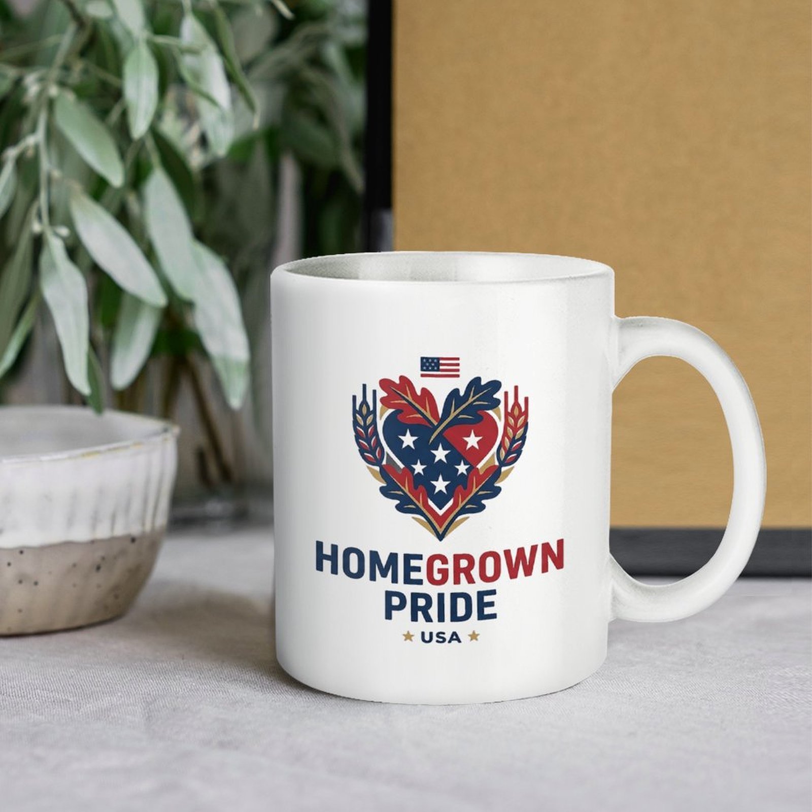 Lifestyle interior shot: Homegrown Pride heart patriotic mug placed on warm wooden table with cotton decor background for home & office desk display