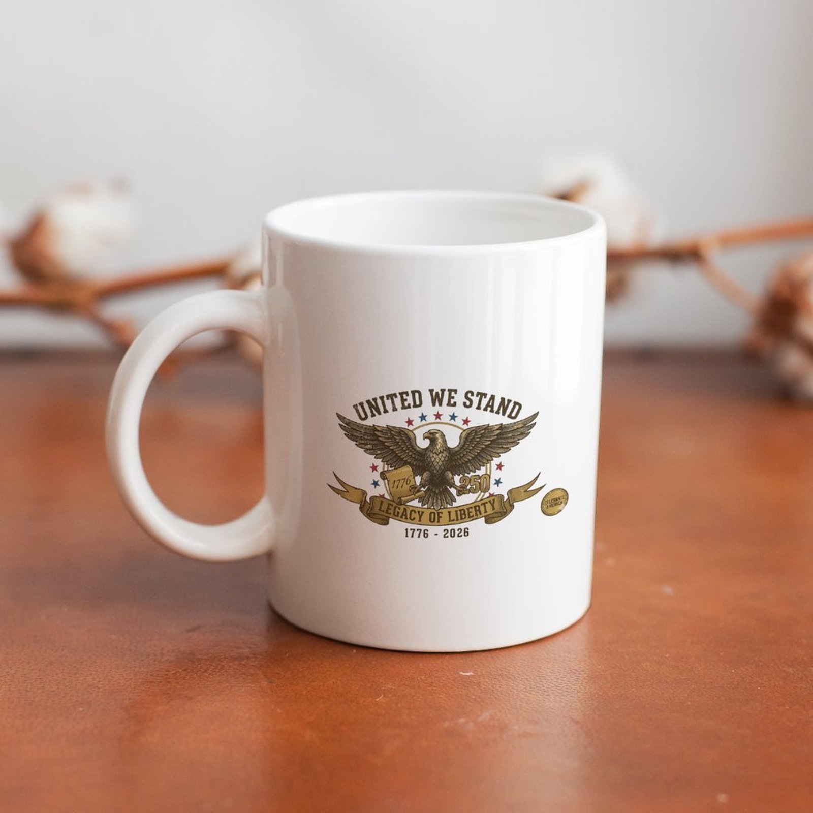Retro United We Stand eagle graphic white ceramic mug resting on rustic wooden table, USA 250 anniversary farmhouse decor drinkware