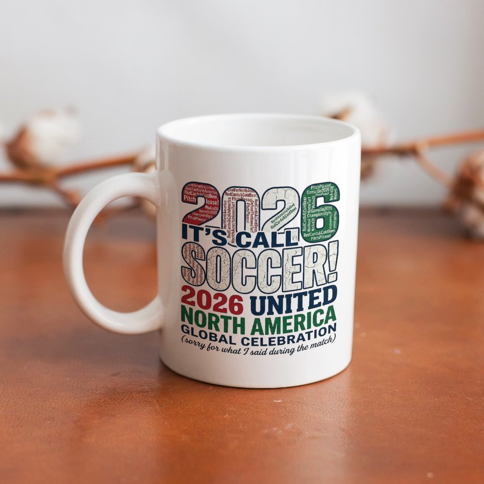 Mug placed on a wooden table, showing the side view of the print and handle in a casual setting.