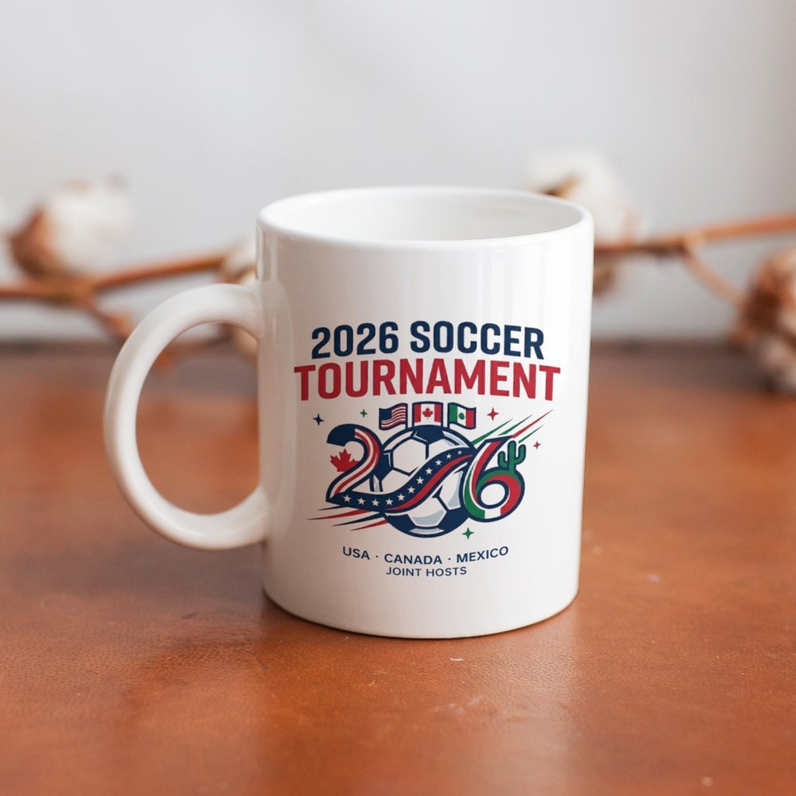 Mug placed on a wooden table, showing the side view of the print and handle in a casual home setting.
