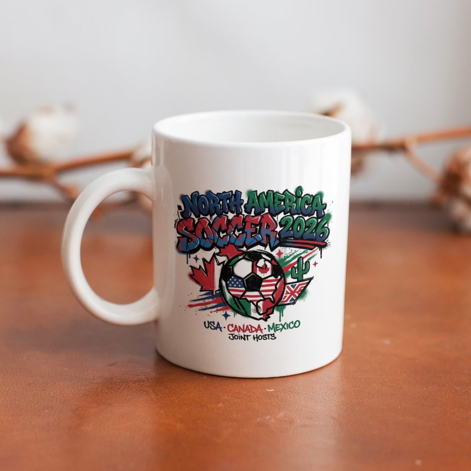 The mug displayed on a wooden table, highlighting the bold street-art tournament design under soft natural light.