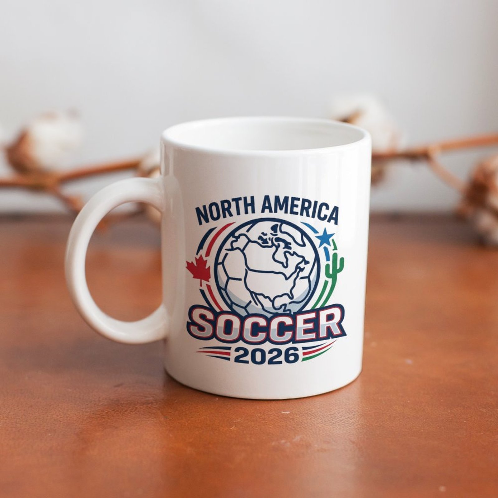 The mug displayed on a wooden table, highlighting the bold tournament logo design under soft natural light.