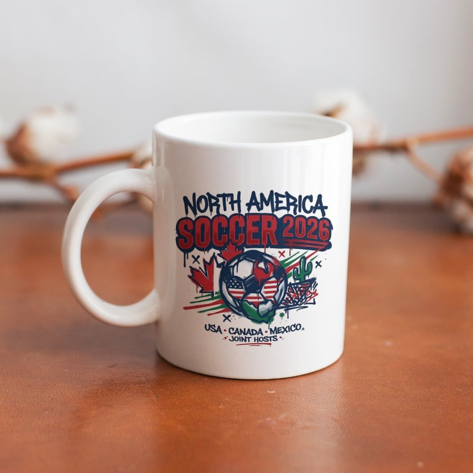The mug displayed on a wooden table, highlighting the bold street-art tournament design under soft natural light.