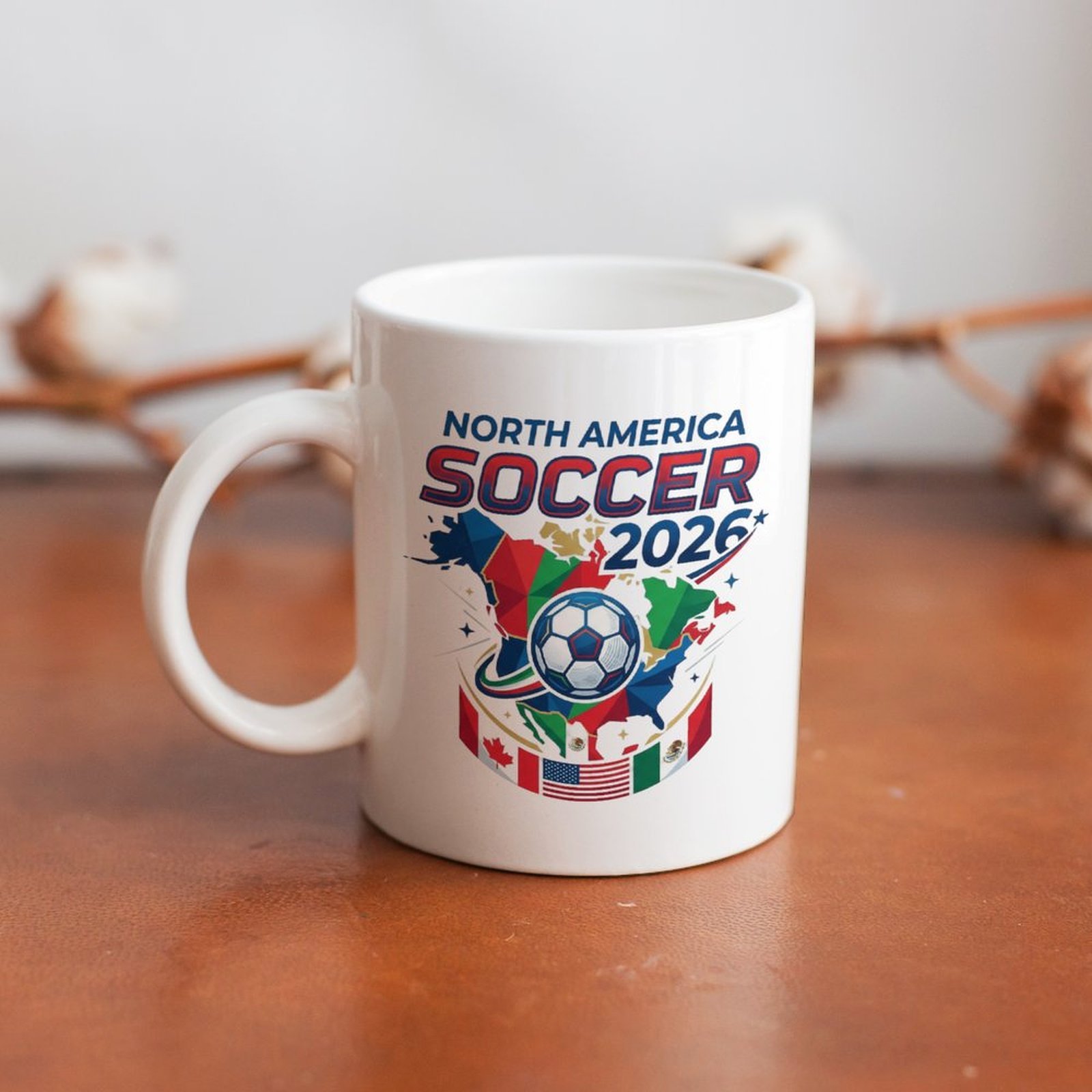 The mug displayed on a wooden table, highlighting the colorful geometric tournament design under soft natural light.