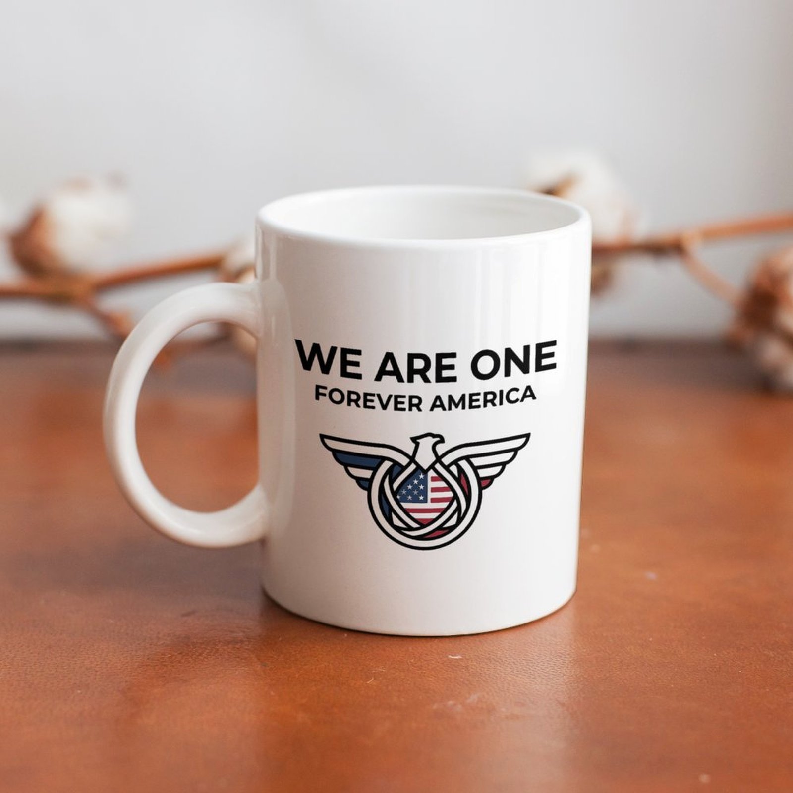The mug displayed on a wooden table, highlighting the clean patriotic design under soft natural light.
