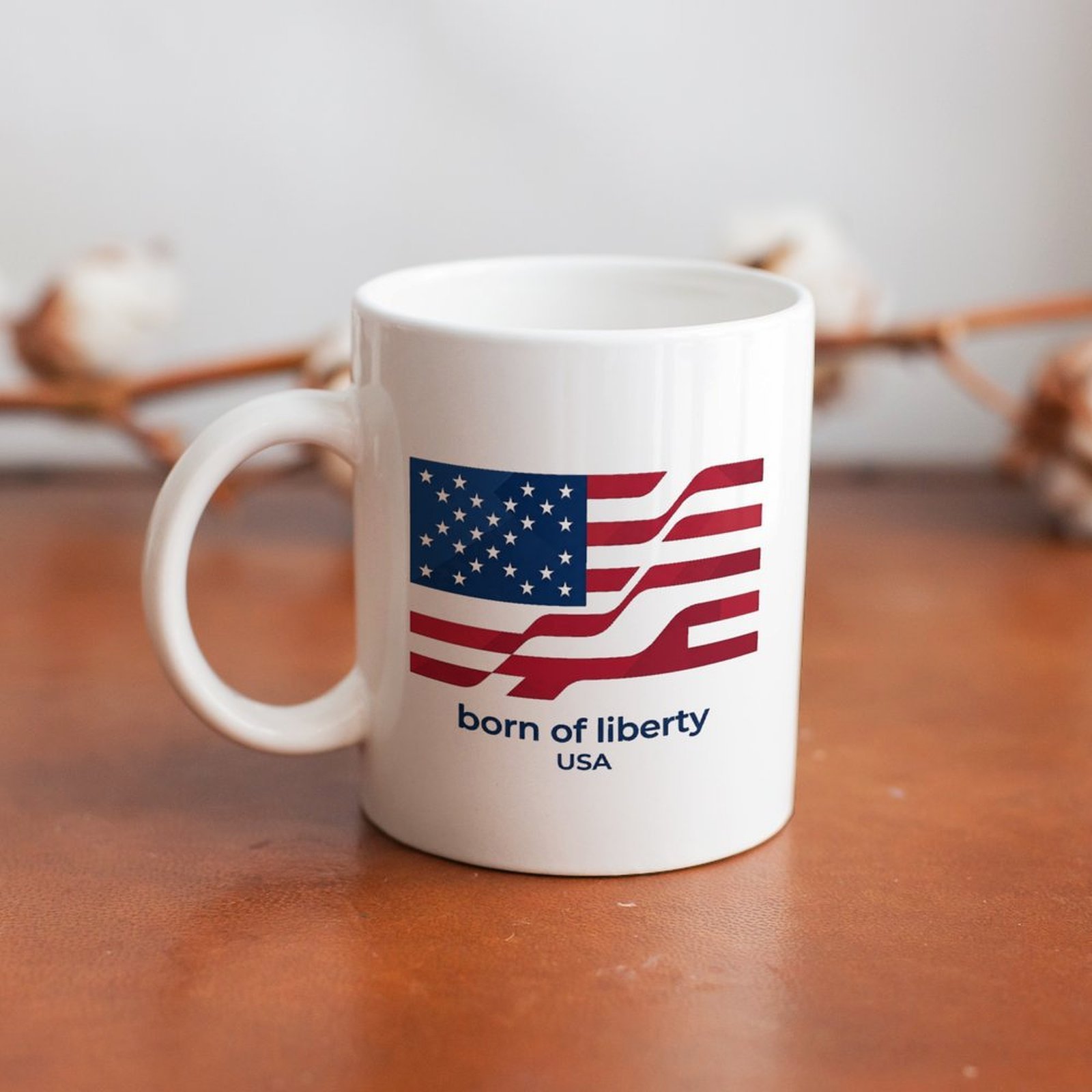 The mug displayed on a wooden table, highlighting the sleek patriotic print under soft natural light.