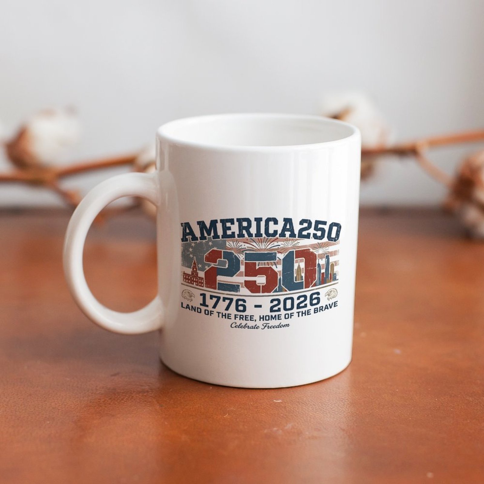 Vintage USA 250th anniversary 1776-2026 graphic white coffee mug placed on rustic wooden table, patriotic home decor drink cup