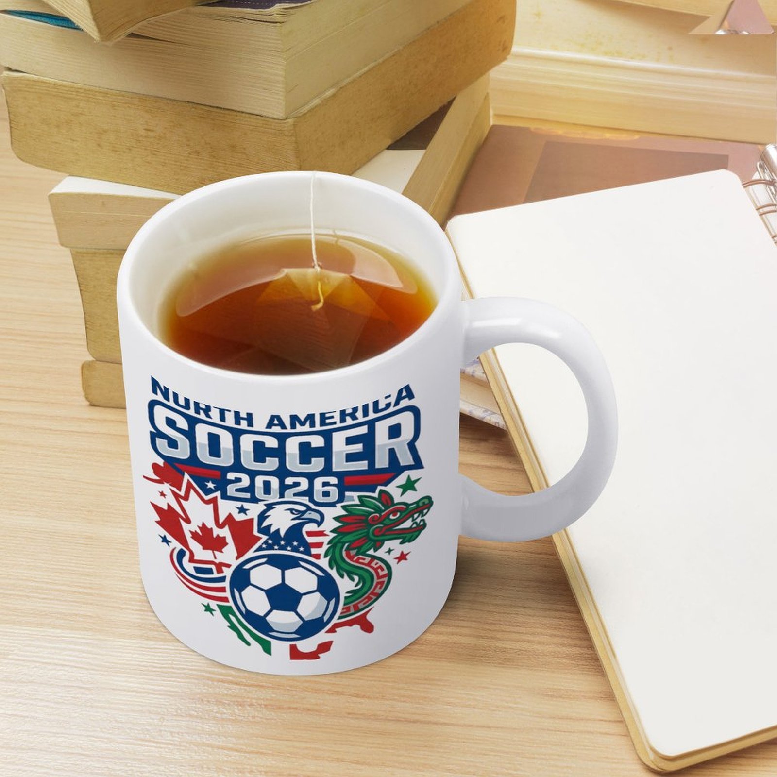 Everyday use scene: the mug with tea on a desk with books and a notebook, showcasing the official-style tournament print.